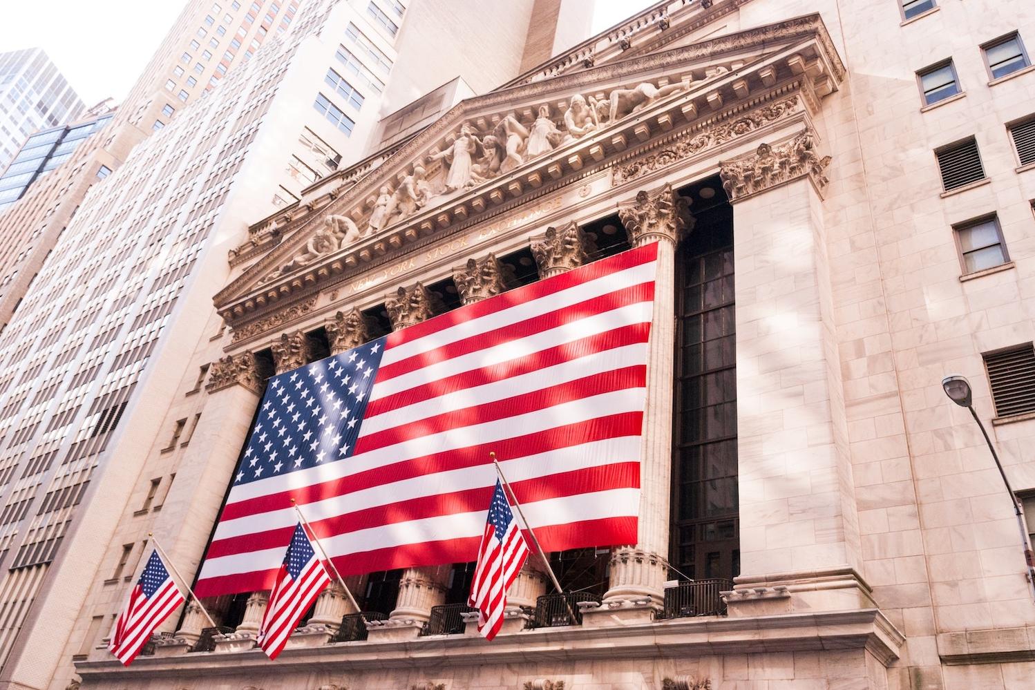 new york stock exchange in new york city with american flags - how is the american public responding to anti-esg anti-woke arguments